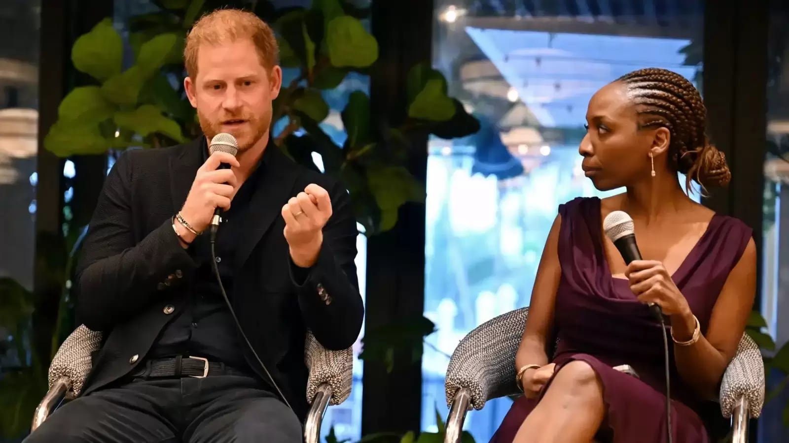 Prince Harry and Dr. Sophie Chandauka in conversation.