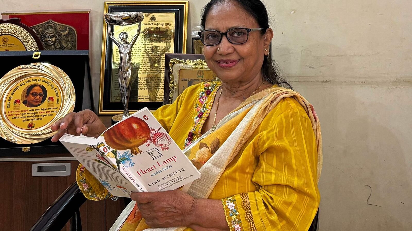 Indian lawyer, activist and International Booker Prize winner Banu Mushtaq posing with her book ‘Heart Lamp’.