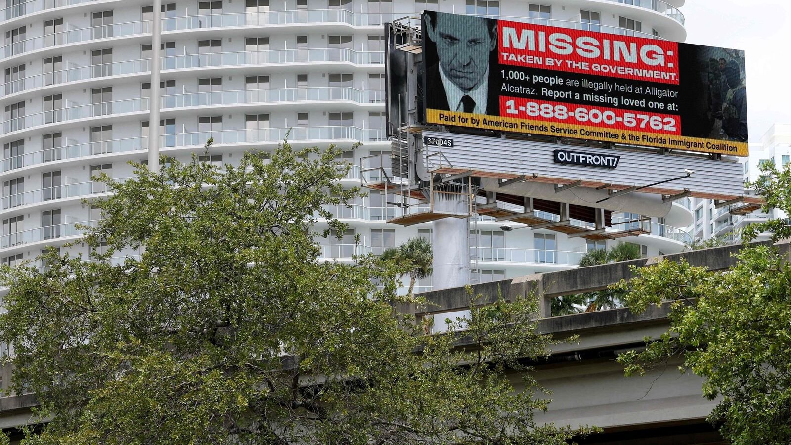 MIAMI, FLORIDA - AUGUST 19: A billboard featuring Florida Governor Ron DeSantis, accuses the government of illegally detaining more than 1,000 individuals at the so-called Alligator Alcatraz detention facility in the Florida Everglades on August 19, 2025 in Miami, Florida. The billboard was placed by the nonprofit Florida Immigrant Coalition. A federal judge in Miami issued a split decision in a lawsuit over the legal rights of detainees at the immigration detention center, dismissing part of the suit and also moving the case to a different jurisdiction. A second lawsuit by environmental groups is expected to receive a ruling by a federal judge later this week.   Joe Raedle/Getty Images/AFP (Photo by JOE RAEDLE / GETTY IMAGES NORTH AMERICA / Getty Images via AFP)