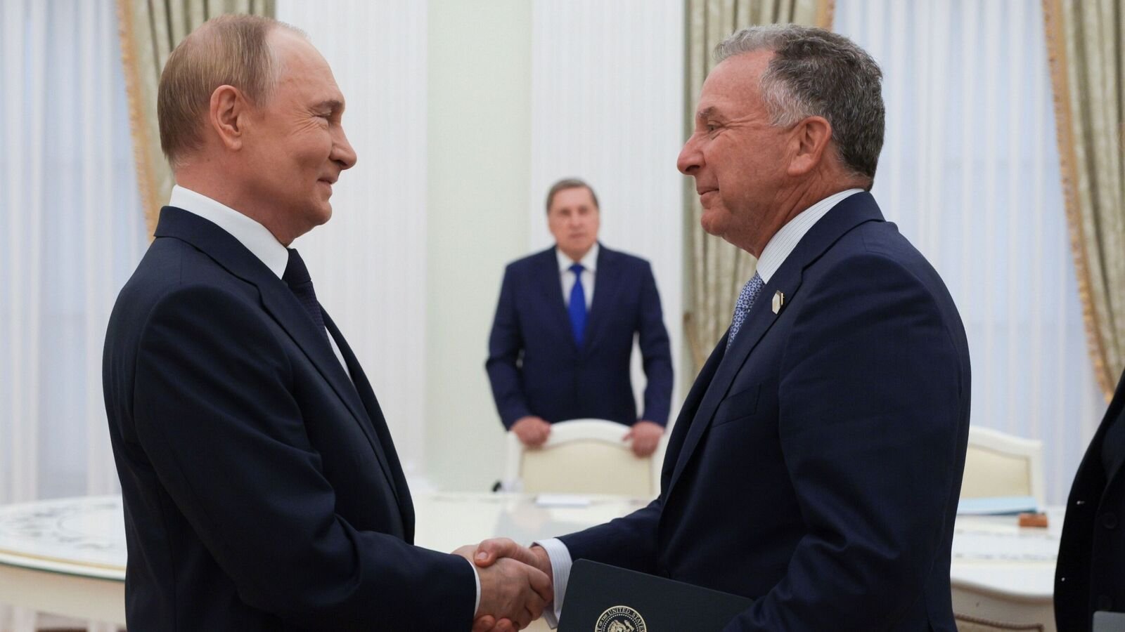 Russian President Vladimir Putin, left, and U.S. President Donald Trump's special envoy Steve Witkoff, right, shake hands during their meeting at the Kremlin in Moscow, Russia, Wednesday, Aug. 6, 2025. AP/PTI(AP08_06_2025_000257B)
