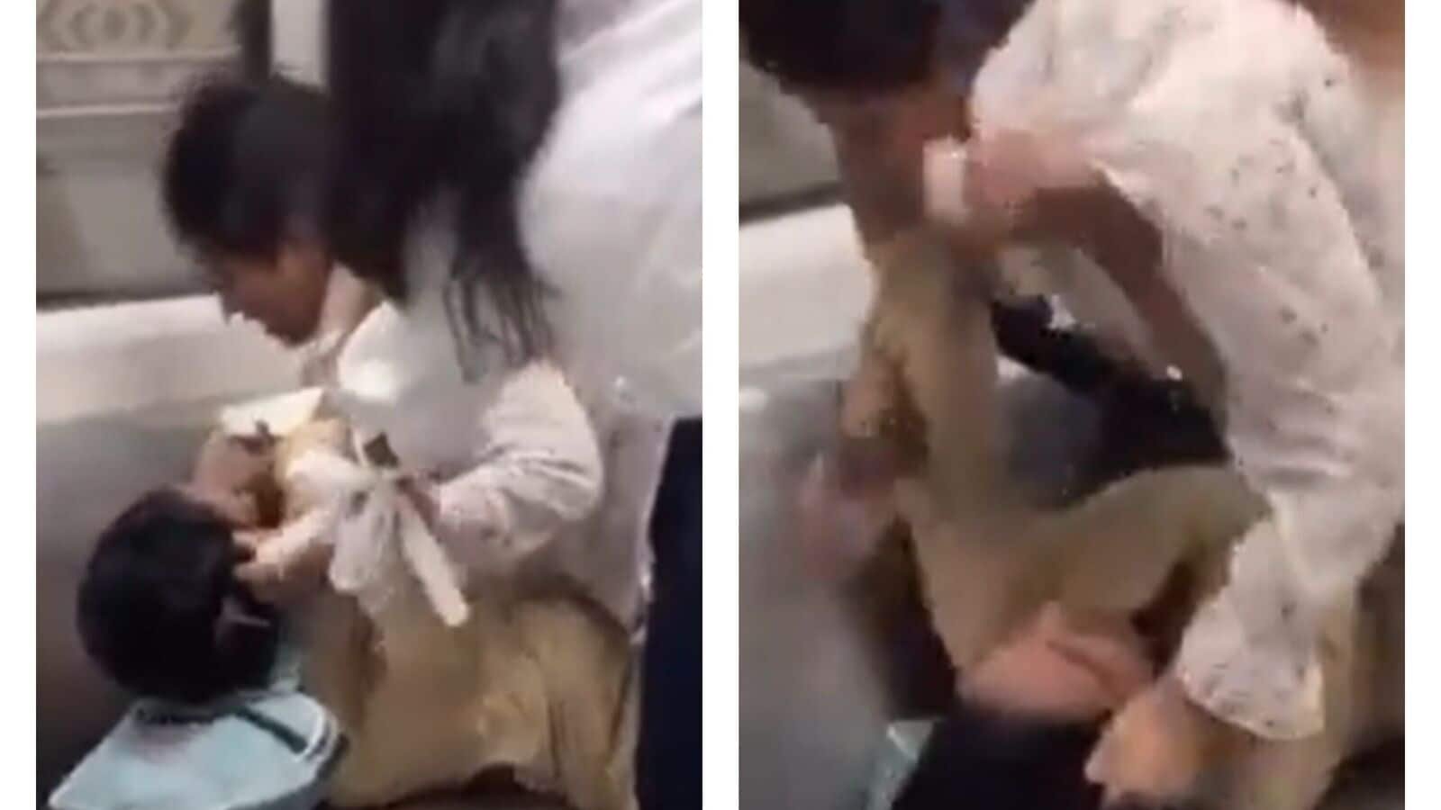 In the 23-second clip, the two women can be seen wrestling each other, almost falling over a seat as they exchange blows.