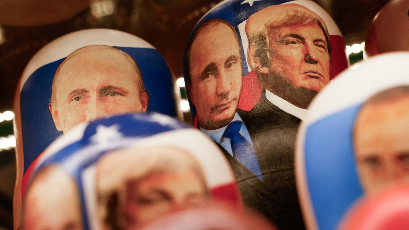Russian traditional nesting dolls, known as Matryoshkas, with images of Russian President Vladimir Putin and U.S. President Donald Trump are placed on a shelf during a demonstration at a gift shop in central Moscow, Russia, August 12, 2025. REUTERS/Yulia Morozova