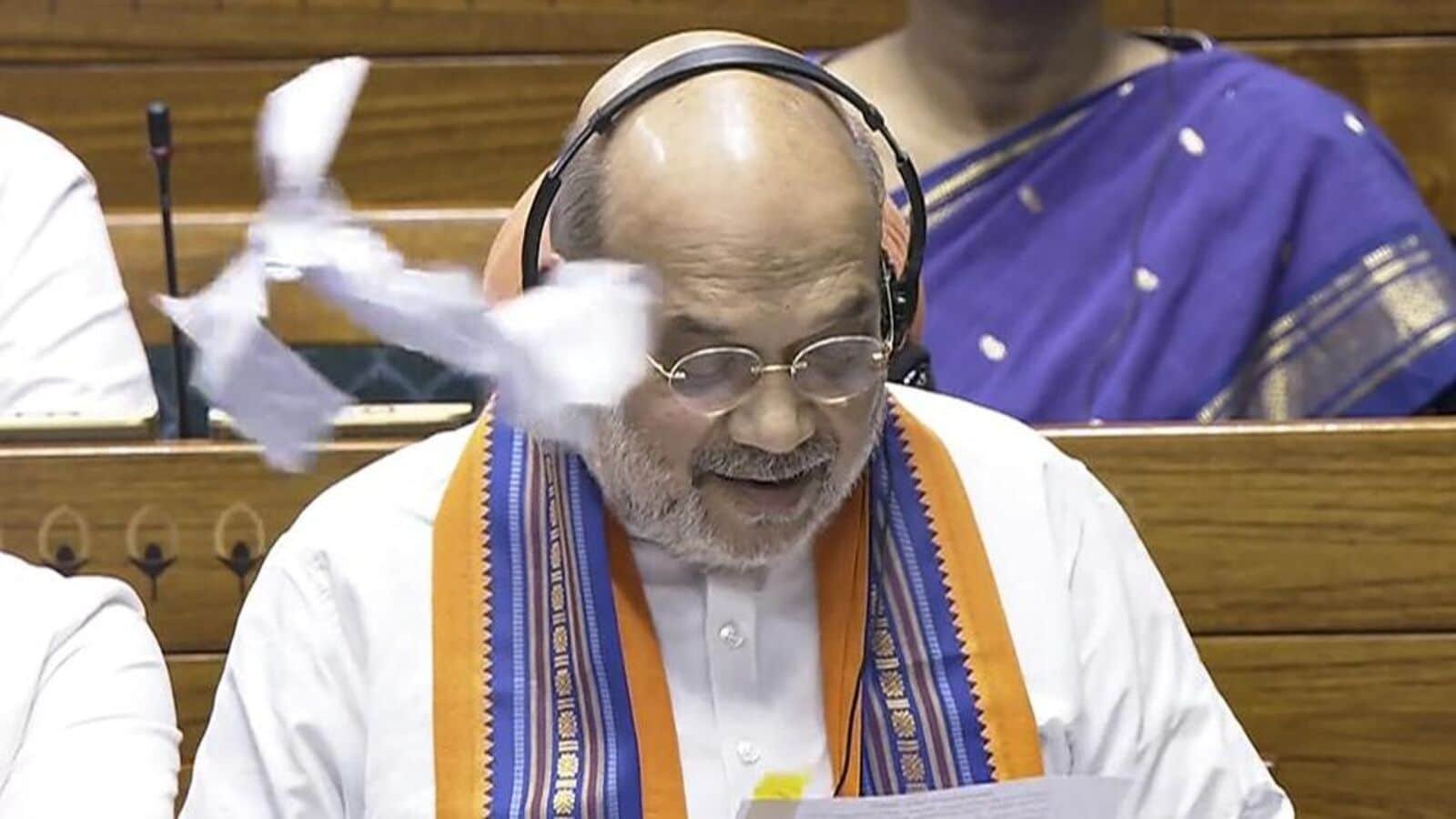 A scrap of paper thrown in front of Union Home Minister Amit Shah in the Lok Sabha, in New Delhi on Wednesday. (PTI)
