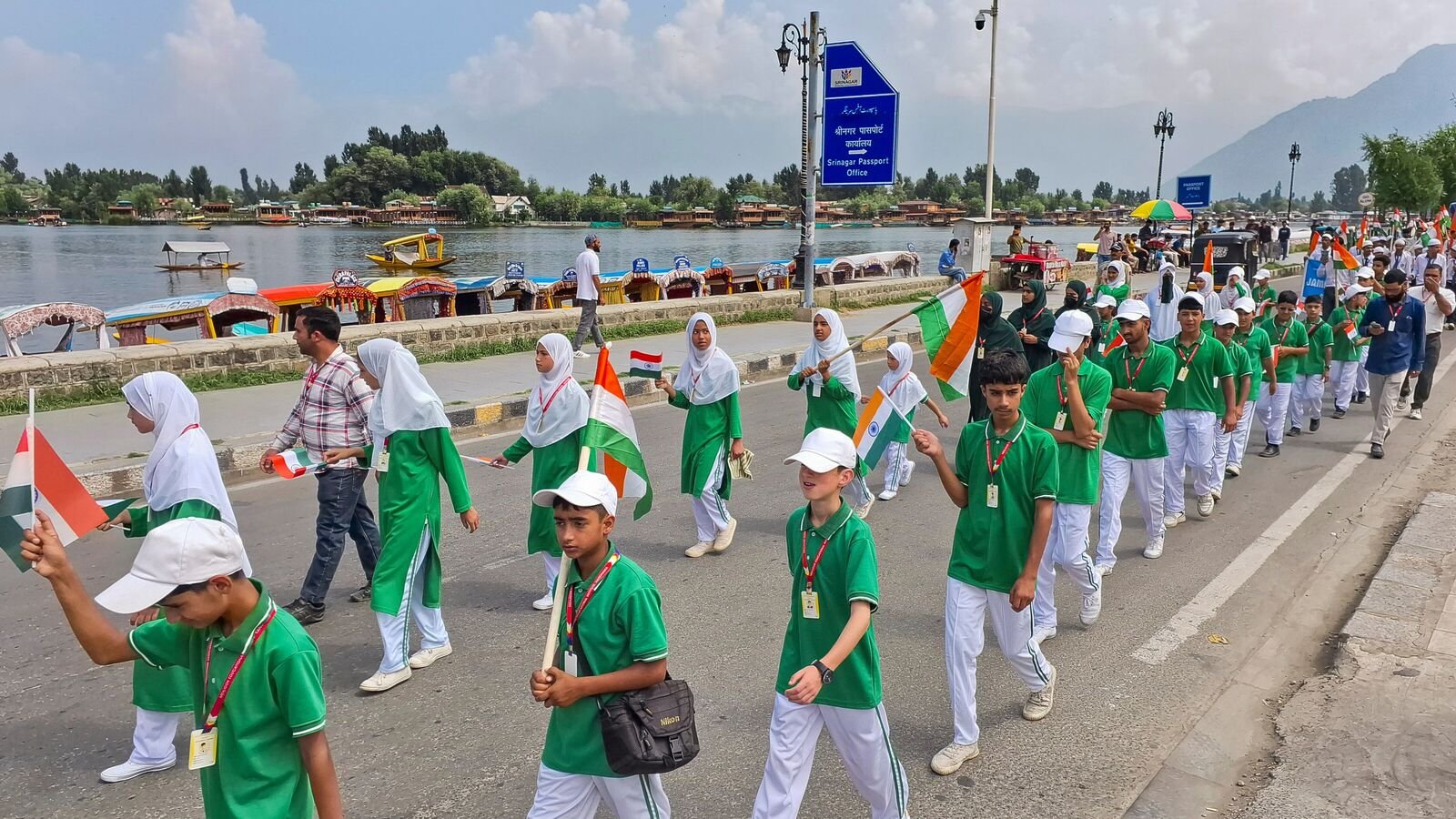 Srinagar: School students participate in a 'Tiranga Rally' ahead of Independence Day, at the bank of Dal Lake in Srinagar, Monday, Aug. 4, 2025. (PTI Photo)(PTI08_04_2025_000136B)