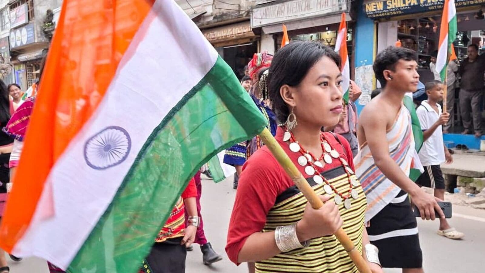 People holding National flags take part in the Har Ghar Tiranga rally, in Agartala on Tuesday. (ANI Photo)