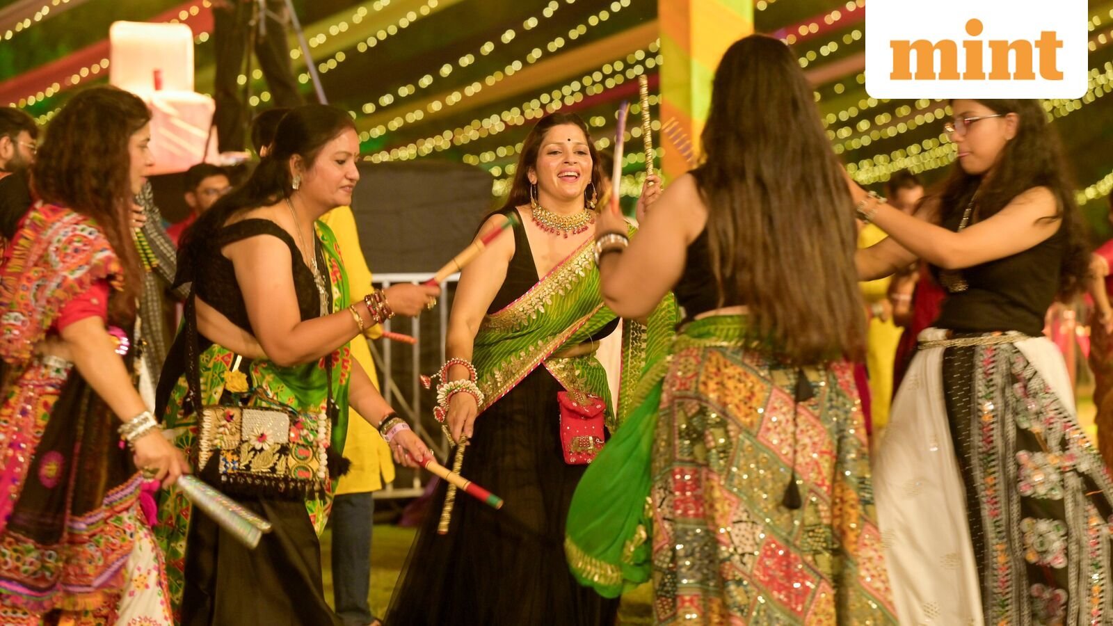 New Delhi, India - Sept. 26, 2025: People perform Garba and Dandiya dance during the Durga Navratri festival  celebration.