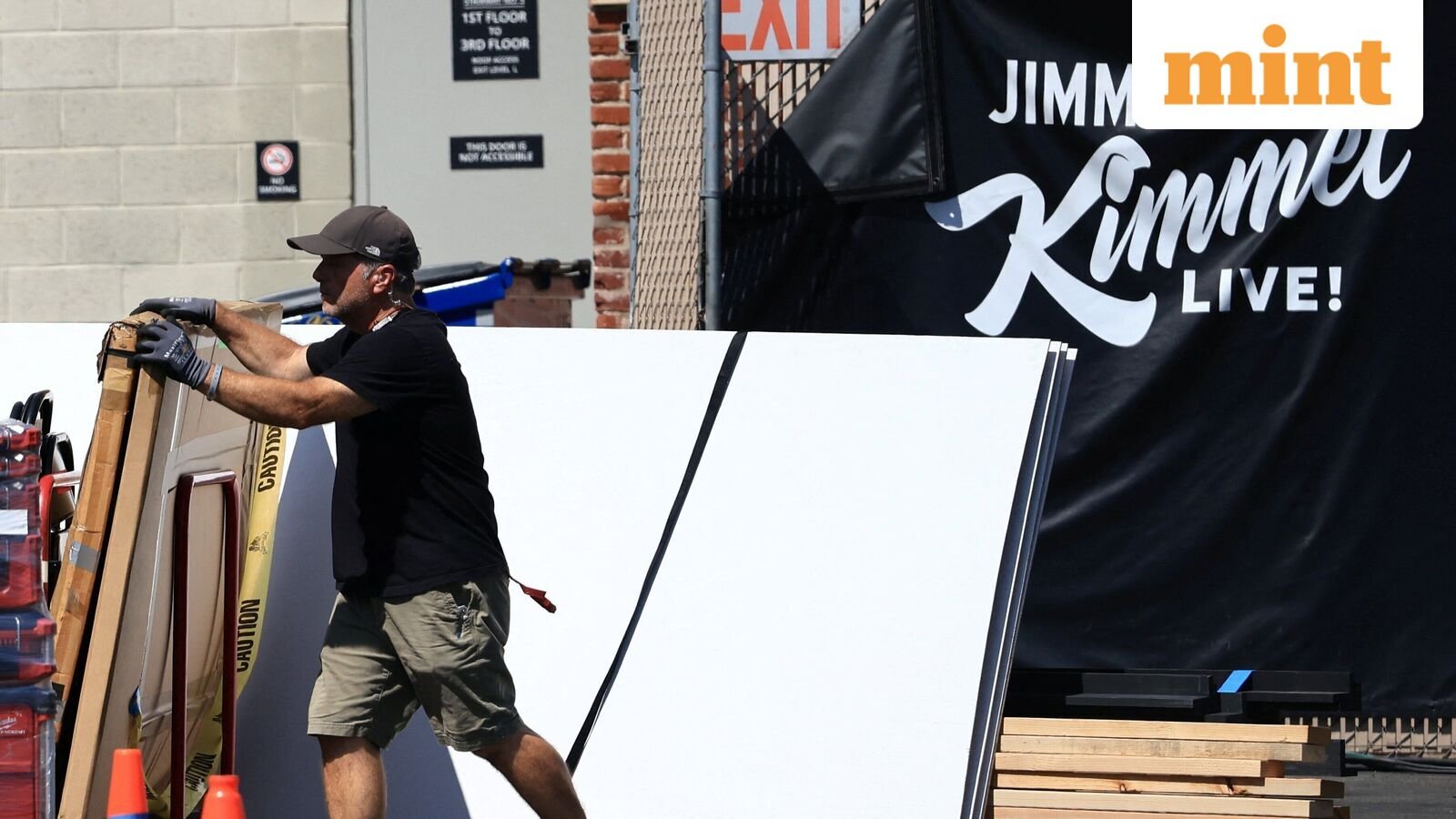 A man helps to load a truck with equipment from the Jimmy Kimmel's late-night talk show after it was suspended for remarks he made regarding Charlie Kirk's assassination, at the back of the Jimmy Kimmel Live studio, in Hollywood, Los Angeles, California, U.S. September 19, 2025. REUTERS/David Swanson