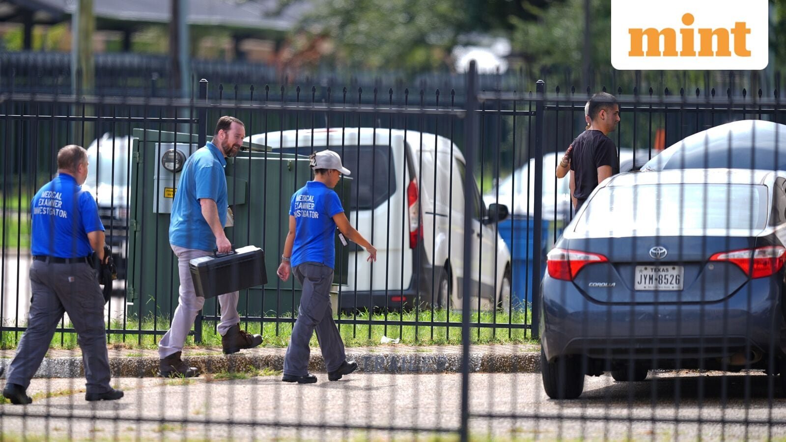 Law enforcement agents at an apartment building near the scene of a shooting at a U.S. Immigration and Customs Enforcement office in Dallas on Wednesday, Sept. 24, 2025. (AP Photo/Julio Cortez)