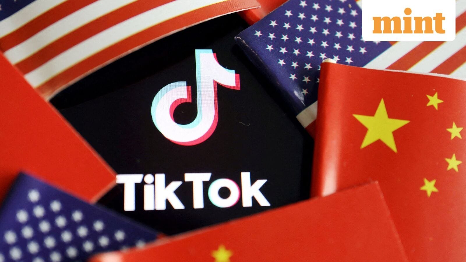China and U.S. flags are seen near a TikTok logo in this illustration picture taken July 16, 2020. REUTERS/Florence Lo/Illustration/File Photo