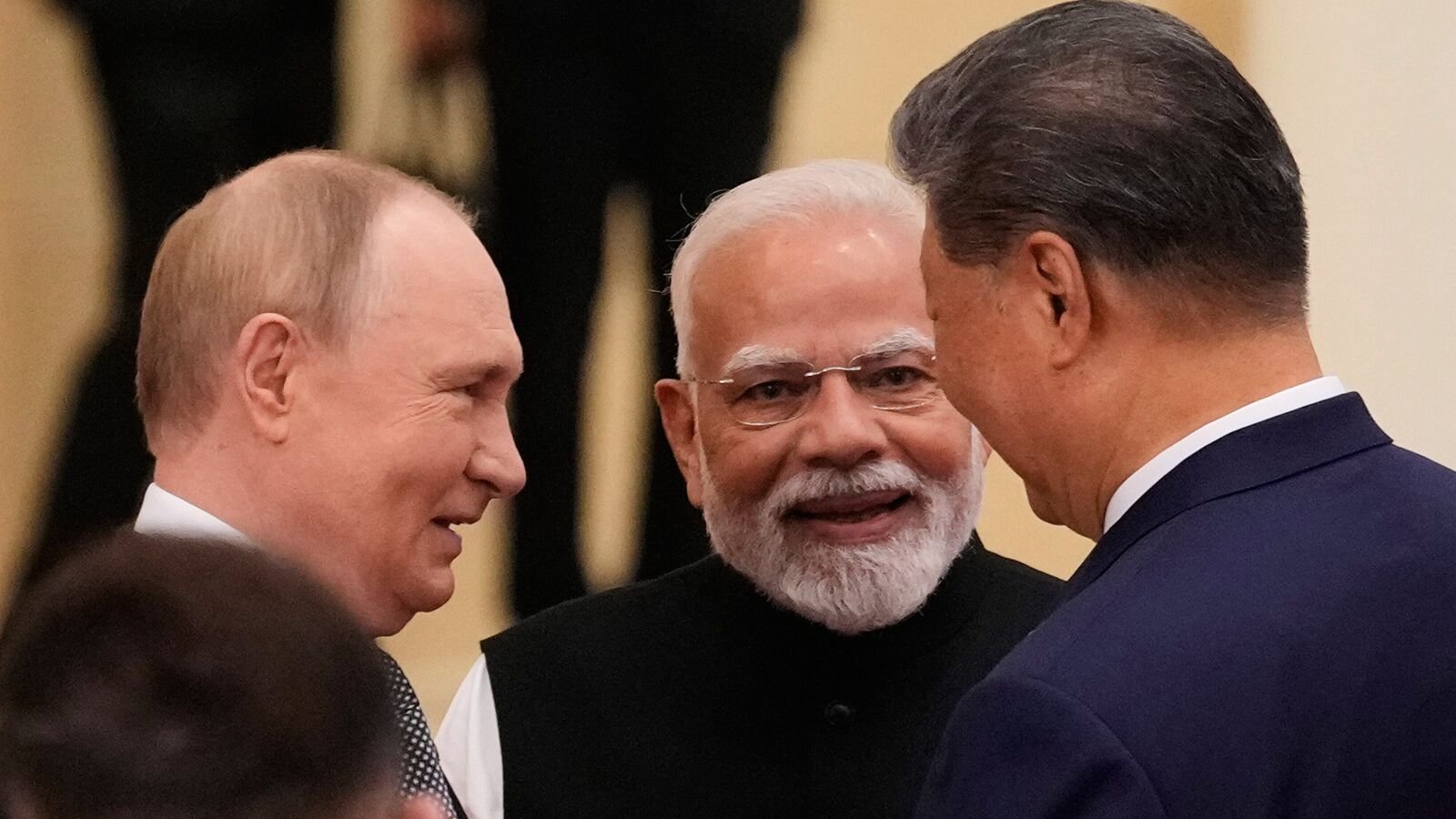 Russian President Vladimir Putin, from left, Indian Prime Minister Narendra Modi and Chinese President Xi Jinping talk ahead of the Shanghai Cooperation Organization (SCO) summit at the Meijiang Convention and Exhibition Center in Tianjin, China, Monday, Sept. 1, 2025.