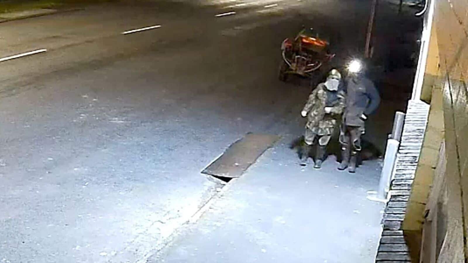 TOPSHOT - This frame grab taken from closed-circuit television camera (CCTV) video footage, shot on August 27, 2025 and released by the New Zealand Police on August 29, 2025 appears to show fugitive New Zealand father Tom Phillips and one of his children steeling grocery items from a store in the northern New Zealand region of Waikato. New Zealand police released rare images on August 29 apparently showing a fugitive father whose nearly four years on the run with his children have gripped the country. Tom Phillips absconded with his three children in December 2021 after a row with his former partner. He has eluded capture ever since, and police say they think he has been hiding out in the rolling hill country of the North Island's Waikato region. (Photo by Handout / NEW ZEALAND POLICE / AFP)