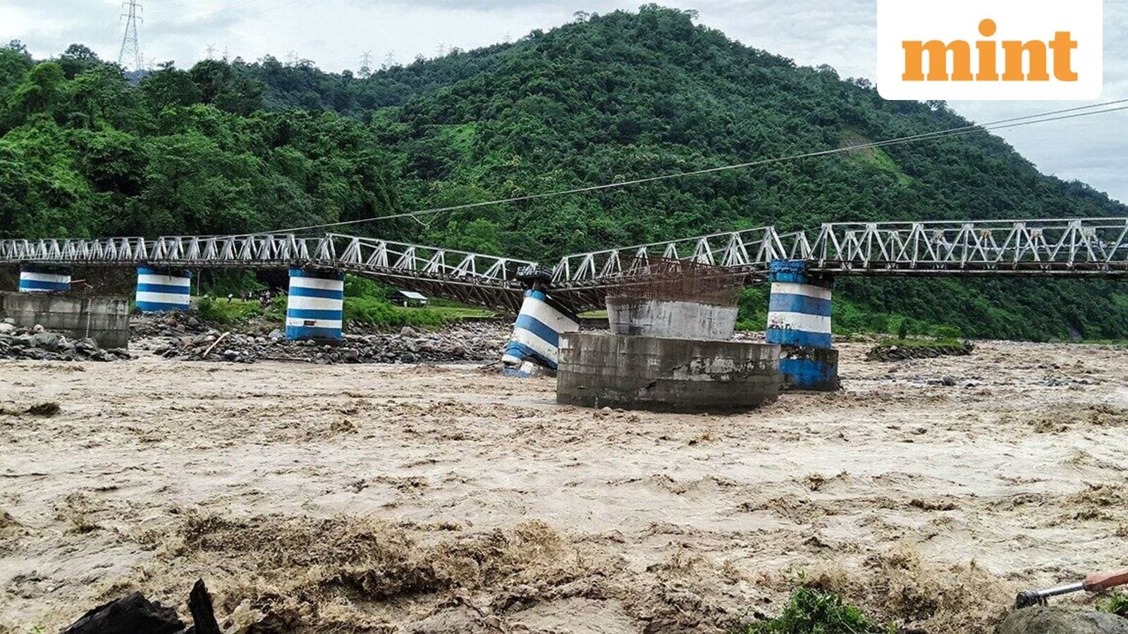 A portion of the Dudhia iron bridge collapsed due to heavy rain, in Darjeeling.
